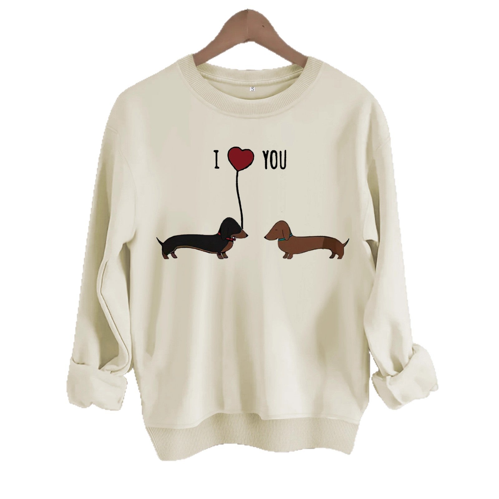 Two dog print hoodies featuring cute dachshunds and a love heart design on a cream sweatshirt.