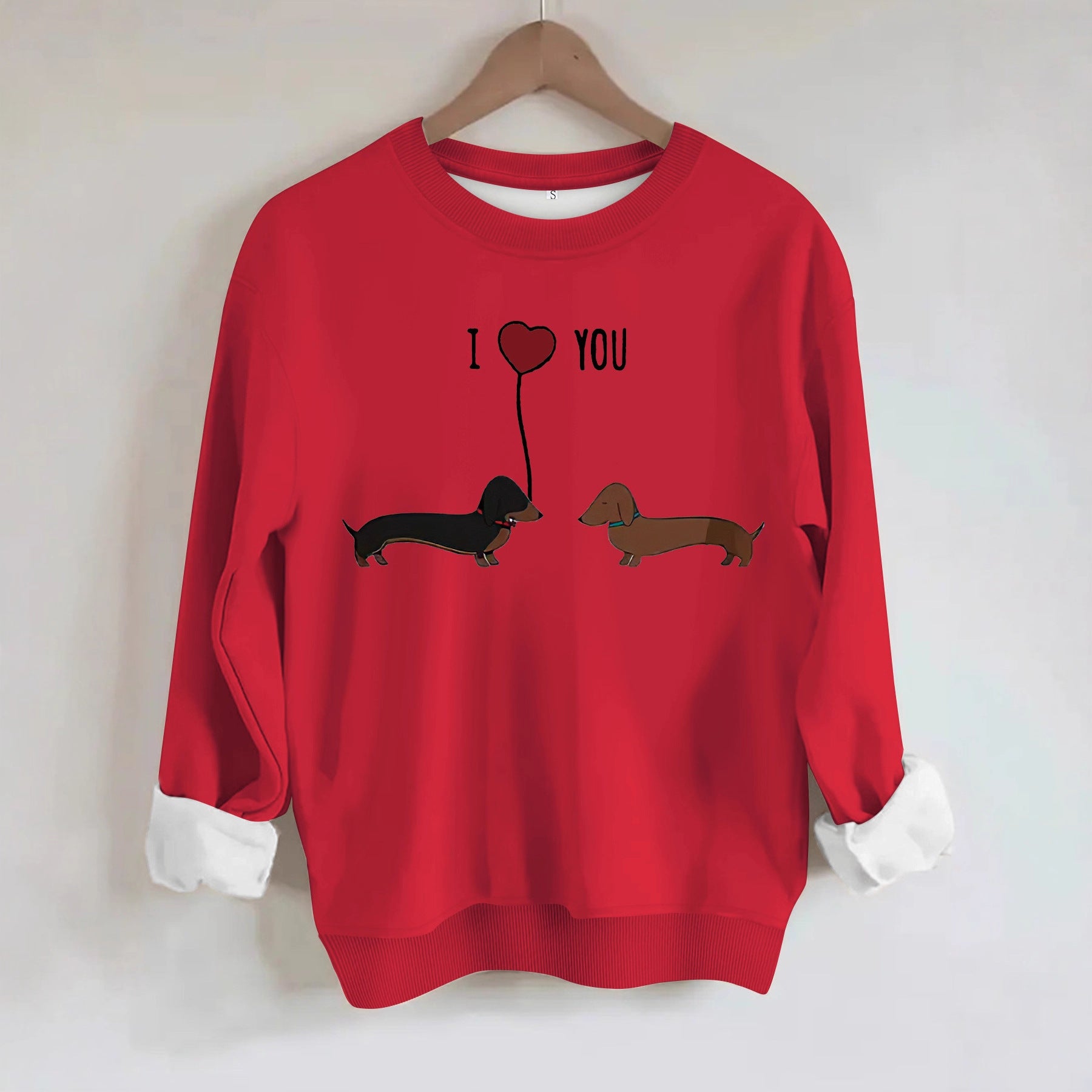 Two dog print hoodies in red with I love you design featuring two dachshunds.